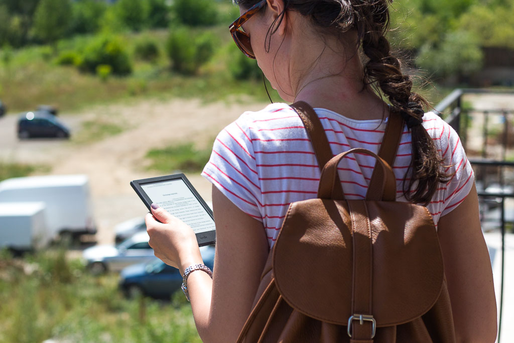 bad habits girl reading on kindle